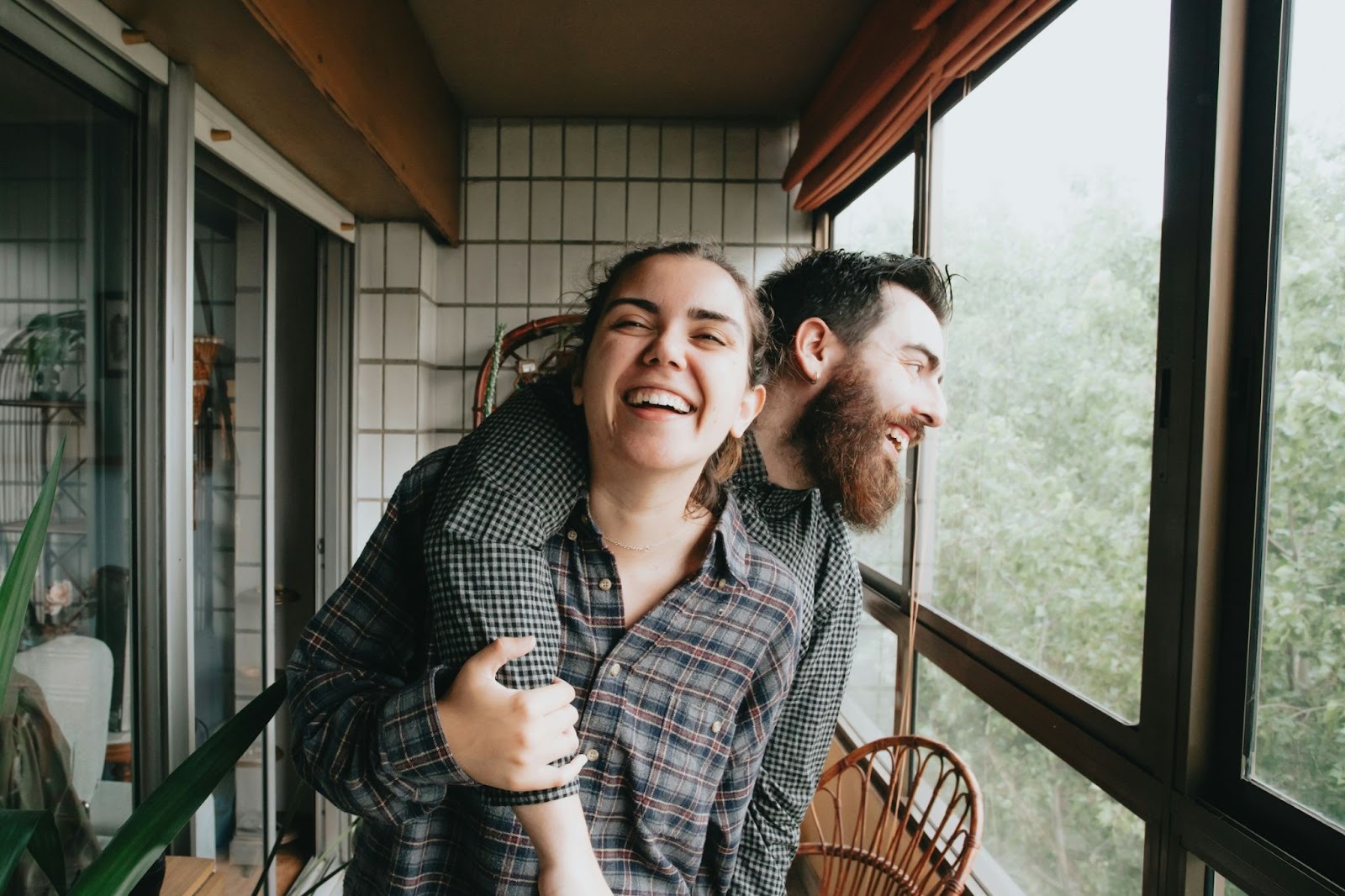 Couple standing together in nature, sharing a quiet moment that reflects love, trust, stability, and freedom