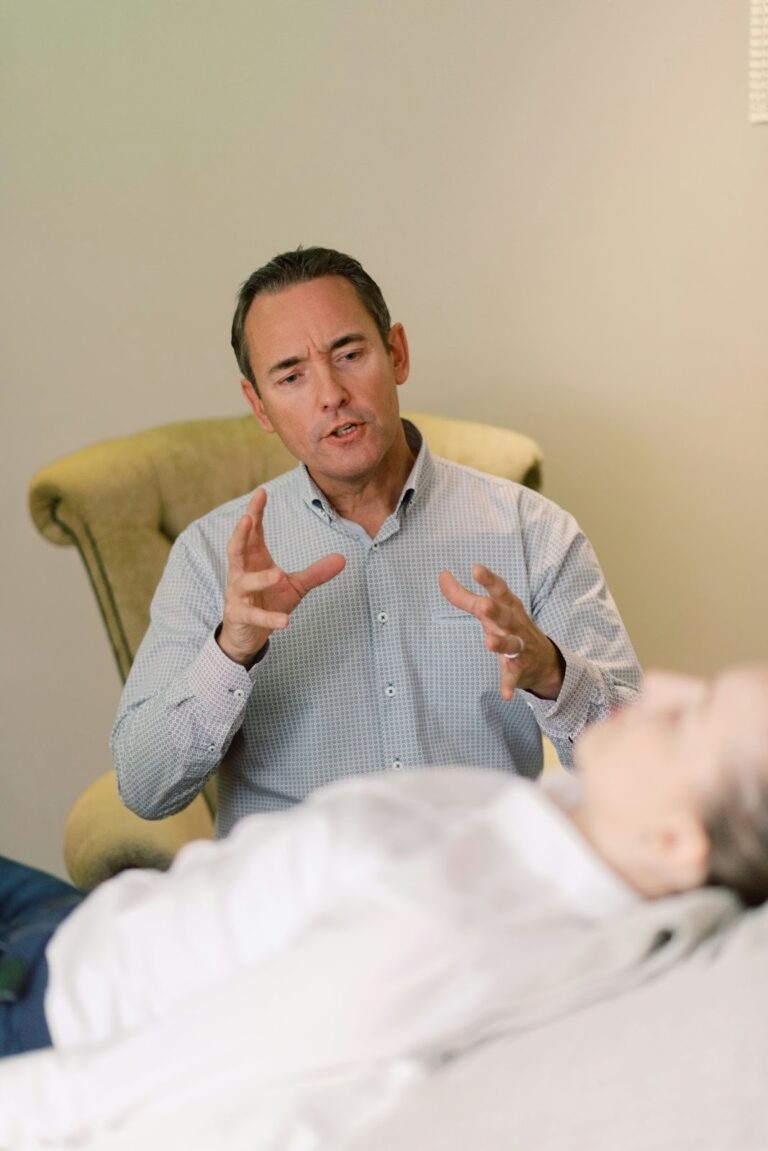 a male therapist with a female client in a psychodynamic therapy session