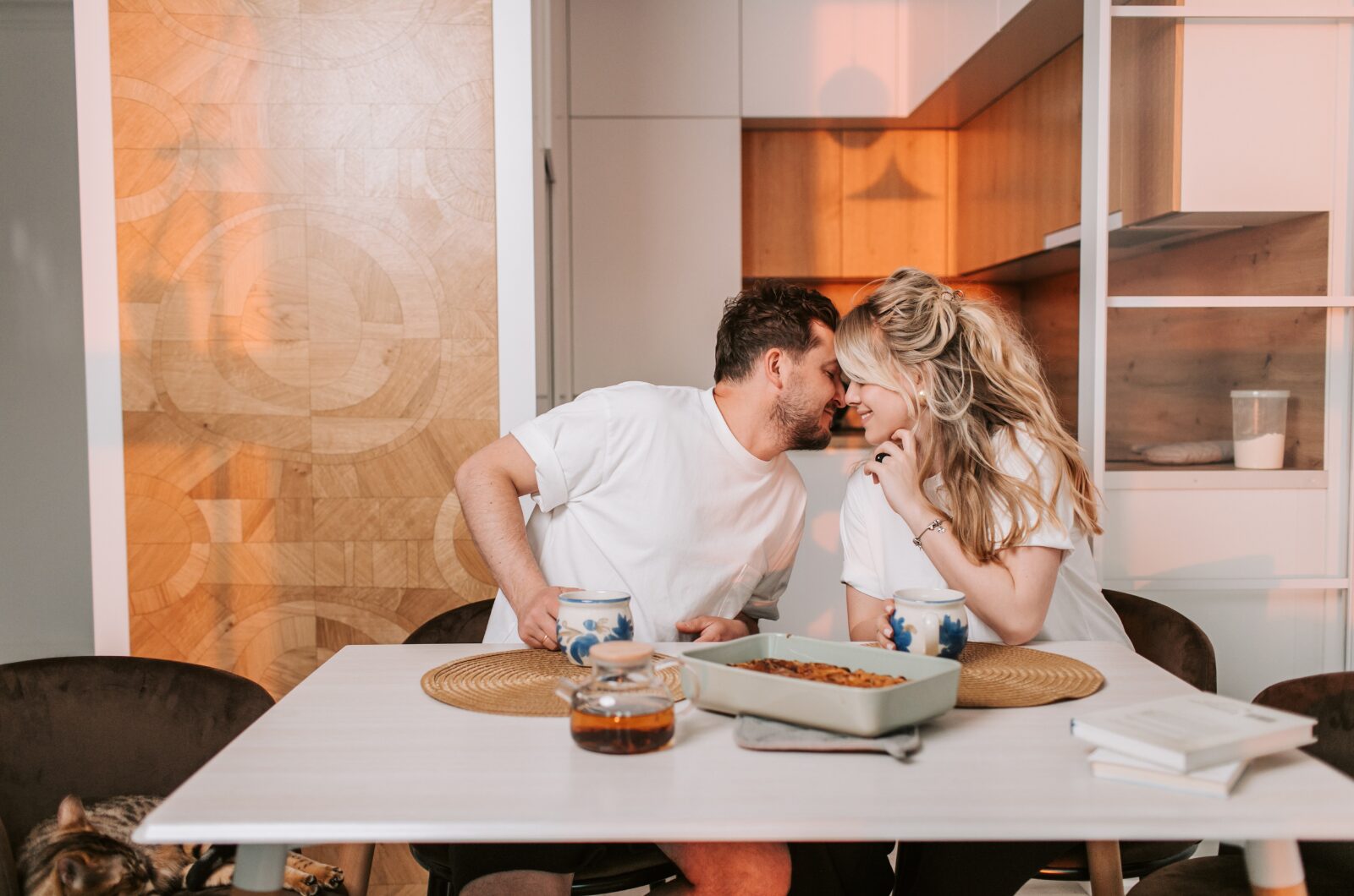 How Imago Therapy Helps Heal Relationship Pain for Couples in San Diego A couple sharing a warm, intimate moment at home, reflecting emotional closeness and connection in a healthy relationship